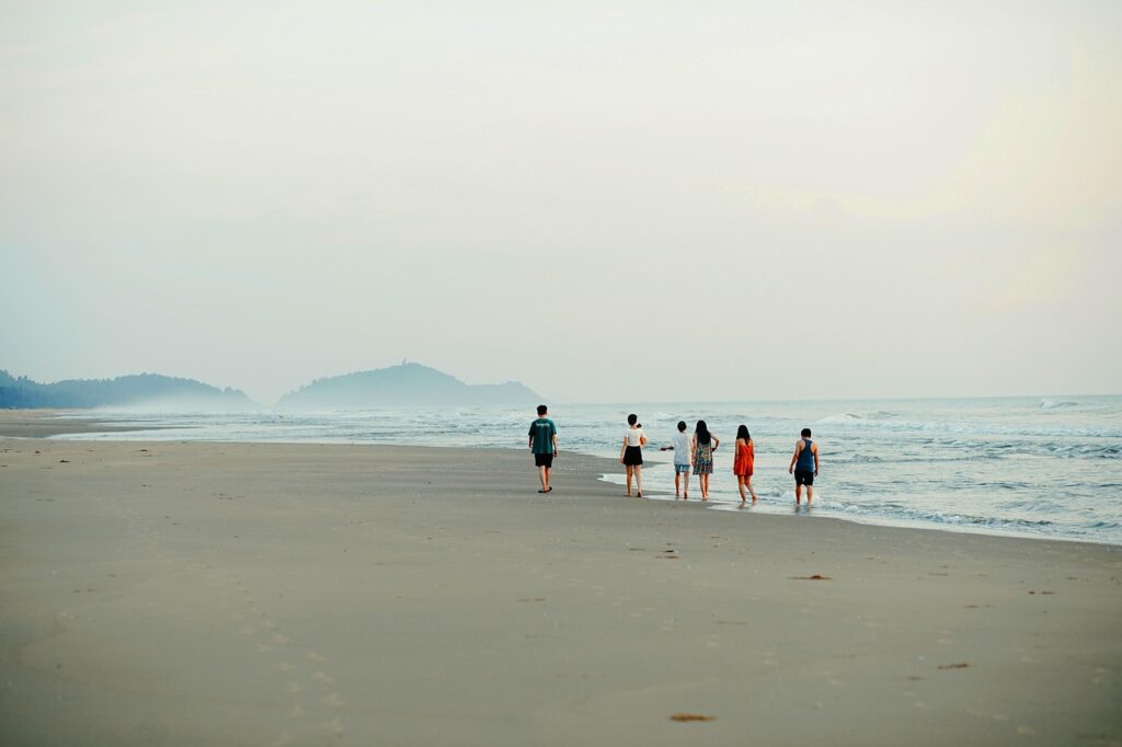 A group of friends enjoying a barbecue on an Australian beach.